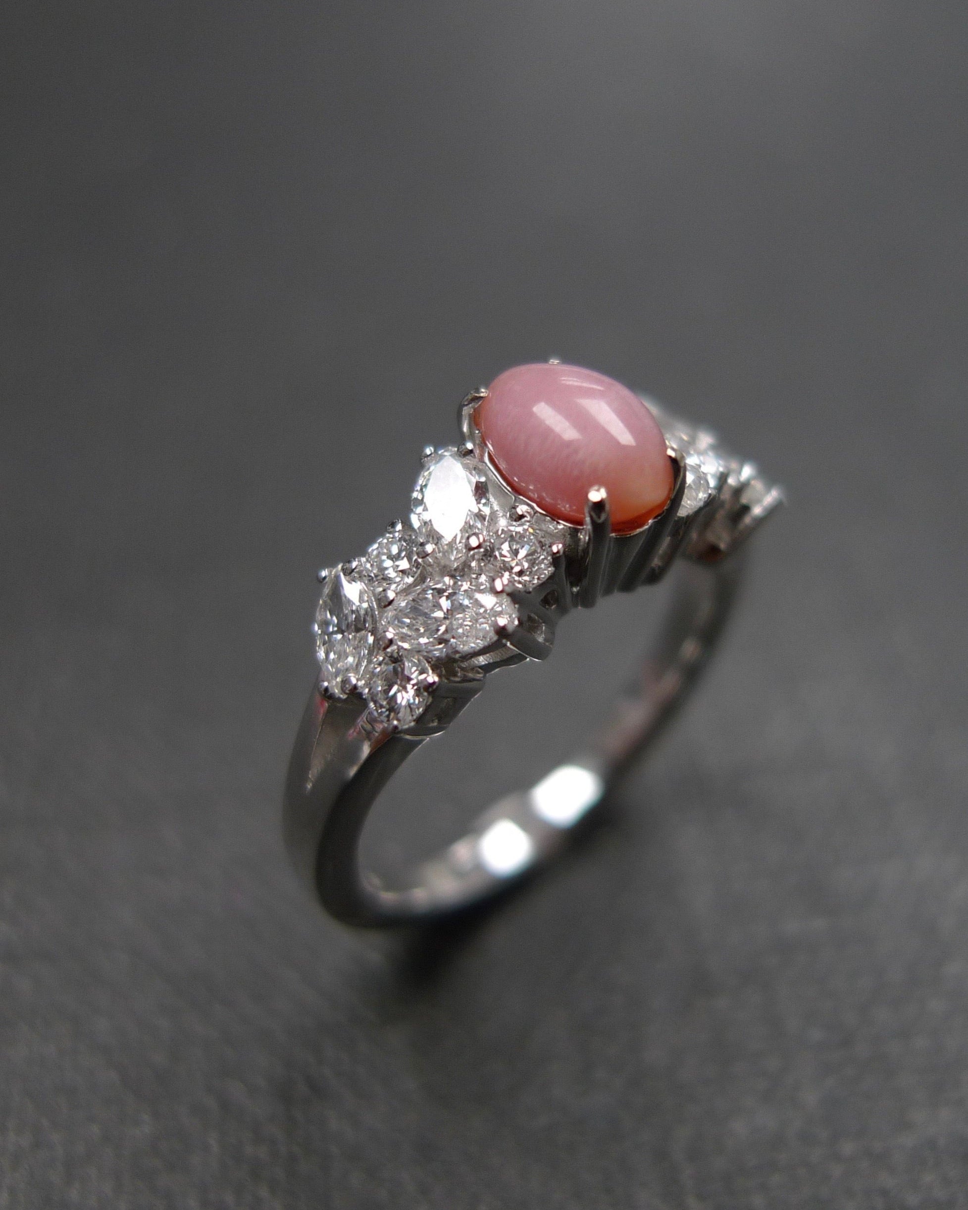 natural conch pearl ring with marquise cut and round brilliant cut diamond accents