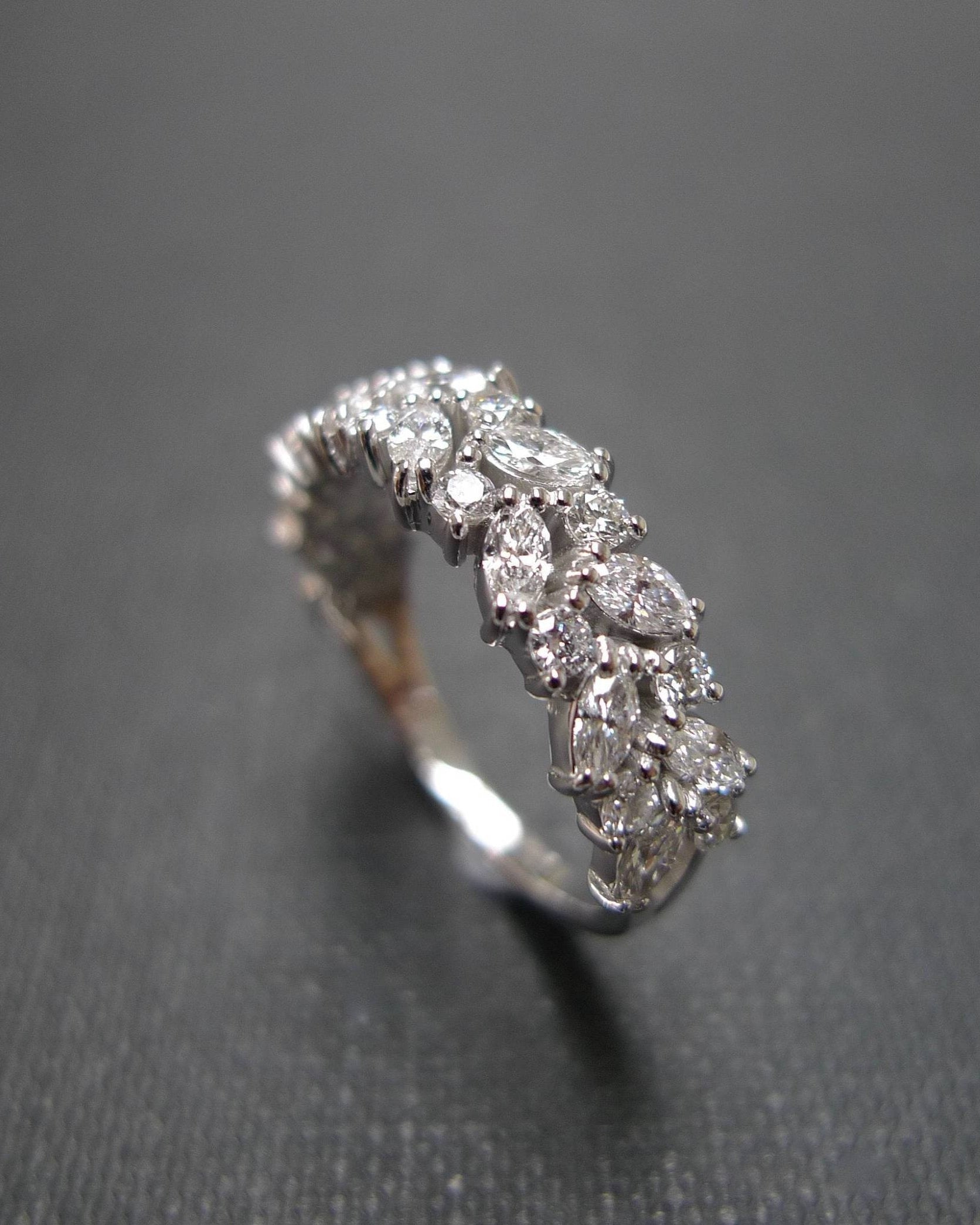 marquise cut and round brilliant cut diamond half eternity ring in 18k white gold